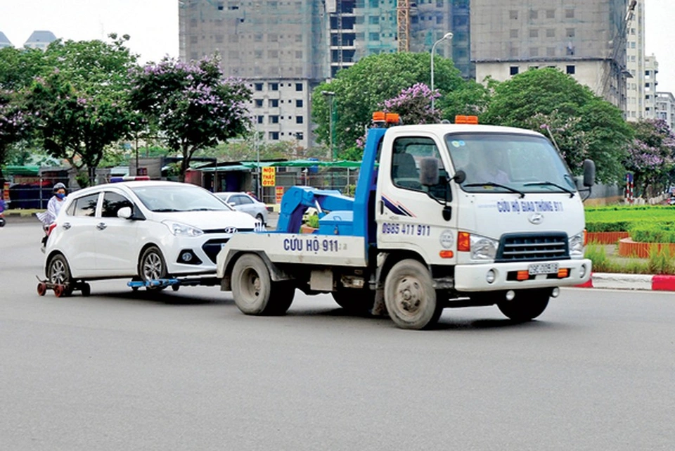 Ai trả tiền khi xe vi phạm bị cẩu đi, CSGT hay người vi phạm? Ai trả tiền khi xe vi phạm bị cẩu đi, CSGT hay người vi phạm?